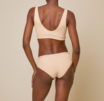 Woman wearing the bliss hiphugger in color beige
