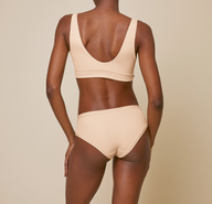 Woman wearing the bliss hiphugger in color beige