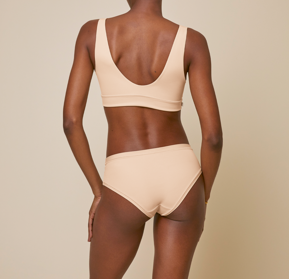 Woman wearing the bliss hiphugger in color beige