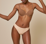 Woman wearing the bliss thong in color beige