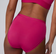 Back view on a white studio backdrop of the Bliss High Waist in Winterberry, highlighting the smooth, full-coverage back and clean leg openings.