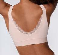 Back view on a white studio backdrop of the Bliss Lace Bralette in Ember Rose, showing the scoop back with lace trim and a smooth, supportive band.