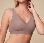 Close-up view of Megan wearing the Bliss Lace Bralette in Mauve. The image focuses on the delicate lace detailing and the smooth design of the bralette. sizing: Megan wears size Small