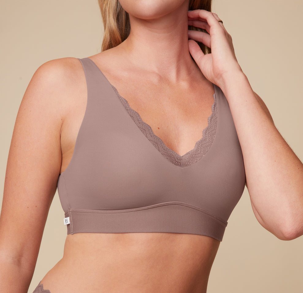 Close-up view of Megan wearing the Bliss Lace Bralette in Mauve. The image focuses on the delicate lace detailing and the smooth design of the bralette. sizing: Megan wears size Small