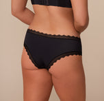 Back view of Sonnie in the Bliss Lace Cheeky Brief in Black. The image showcases the cheeky rear cut with soft lace edges designed to lay flat without digging.