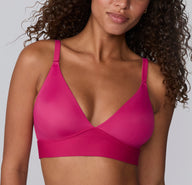 Front view on a white studio backdrop of a model wearing the Bliss Triangle Bralette in Winterberry, featuring the triangle silhouette, adjustable straps, and soft microfiber fabric. sizing: Courtney wears size Small