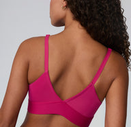 Back view on a white studio backdrop of the Bliss Triangle Bralette in Winterberry, highlighting the V-shaped back, adjustable straps, and smooth supportive band.
