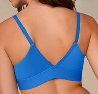Back view of Alexis wearing the Bliss Triangle Bralette in Bluebird, showing the soft V-shaped back and supportive elastic underband.