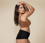 Woman wearing the Bliss Triangle Bralette in the color Brown