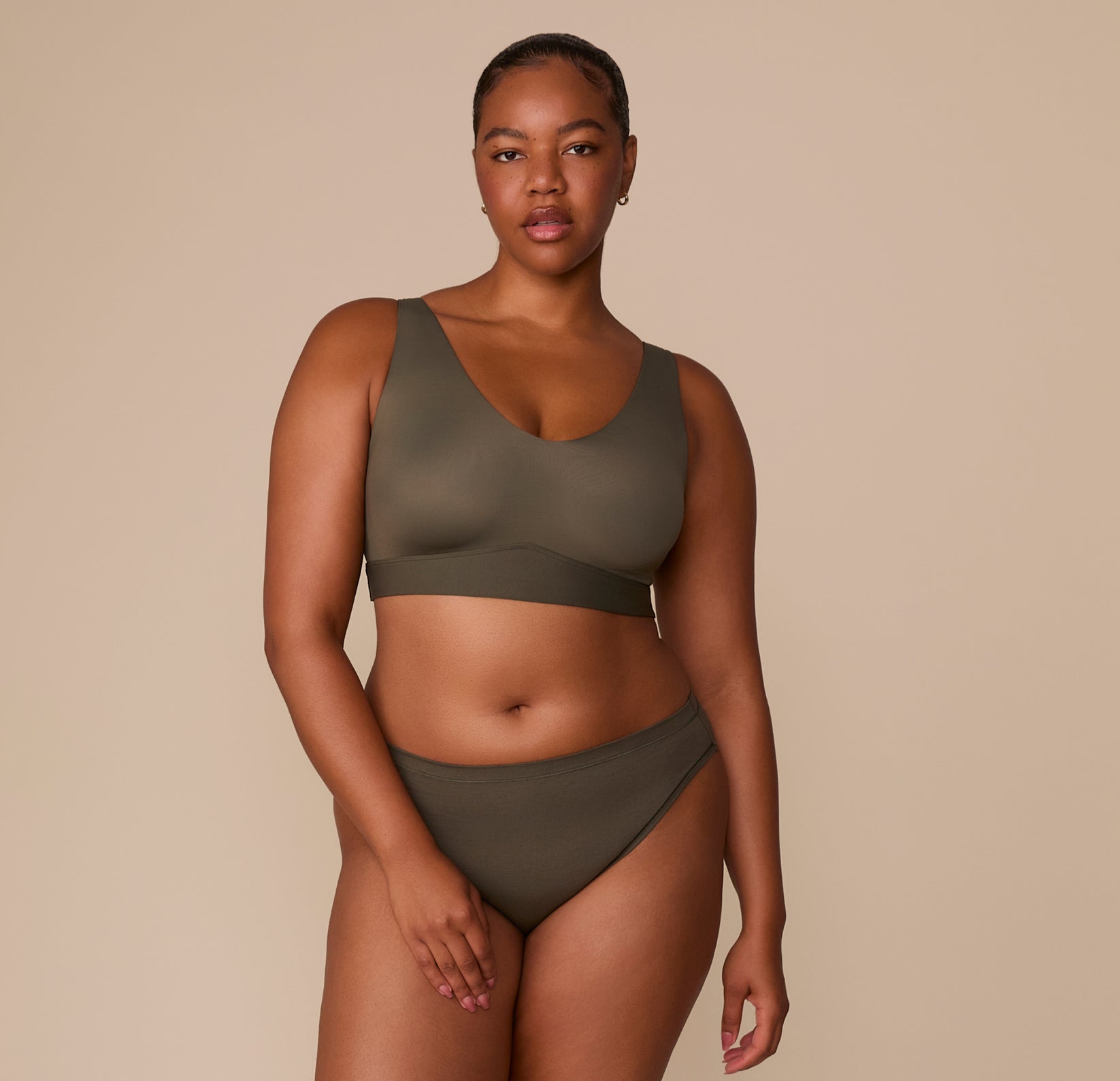 Zarria in the Cloud Cotton Bikini in Olive with matching bralette, standing in a relaxed full-body pose.