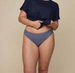 Front shot of Summerlyn wearing the Cloud Cotton Bikini in Slate. The soft cotton fabric and stretchy, comfortable fit are emphasized. sizing: Summerlyn wears size Large