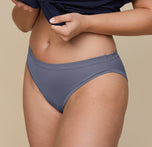 Up close shot of Summerlyn wearing the Cloud Cotton Bikini in Slate. The comfortable fit, medium coverage, and stretchy fabric are emphasized. 