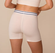 Rear view of Freya in the Cloud Cotton Retro Boxer Brief in Quartz. The wide waistband and comfortable, mid-thigh length offer full coverage and a secure fit.