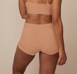 Back view of Nemesis in the Cloud Cotton High Waist Boyshort in Dune. The wide waistband and full rear coverage offer a smooth, secure fit without digging in.