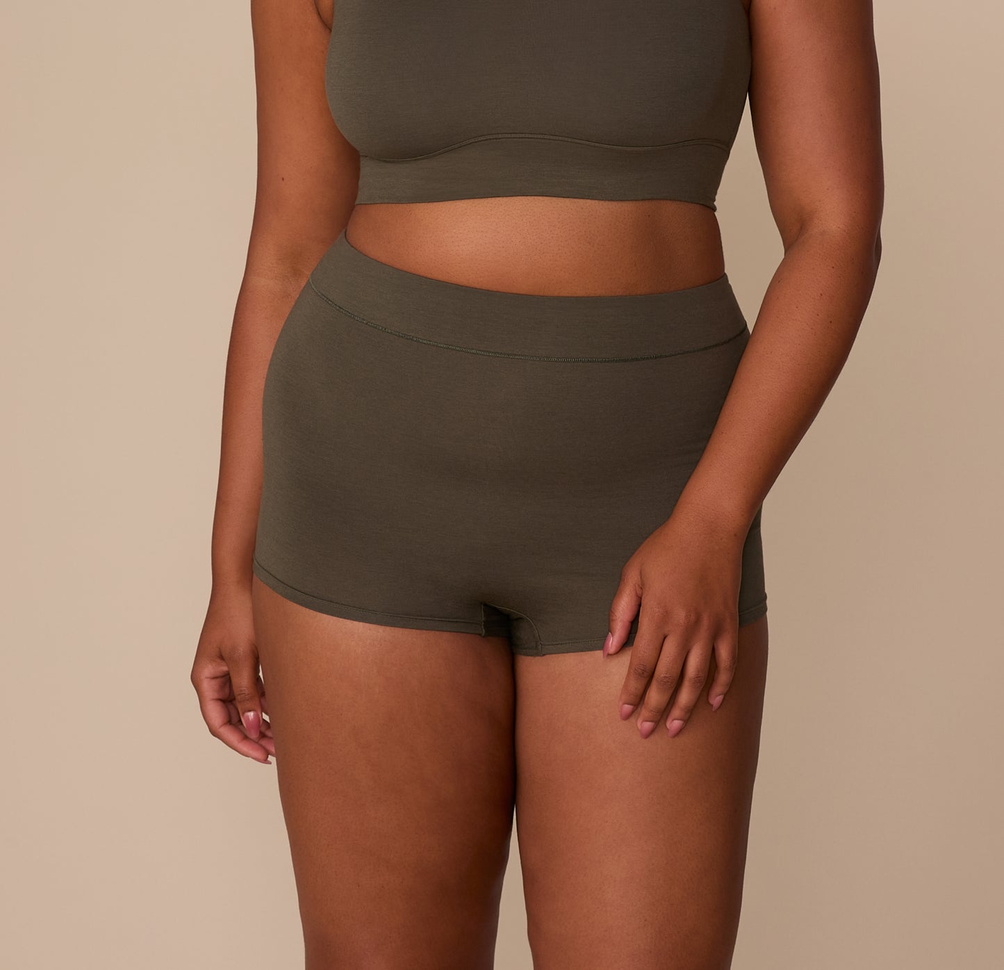 Close-up of Zarria wearing the Cloud Cotton Highwaist Boyshort in Olive, showing the soft waistband and full coverage fit. sizing: Zarria wears size XL