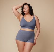 Full-body view of Bianca standing confidently in the Cloud Cotton Triangle Bralette and Highwaist Boyshort in Slate. 