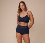 Full-body image of Sonnie wearing the matching Cloud Cotton Triangle Bralette and Highwaist Boyshort in Midnight. Her confident stance emphasizes the coordinated comfort and modern silhouette of the set.