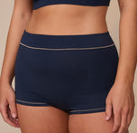 Cropped close-up of the Cloud Cotton Highwaist Boyshort in Midnight on Sonnie. The image shows the soft waistband and detailed stitching, highlighting the supportive fit and breathable cotton-modal blend.