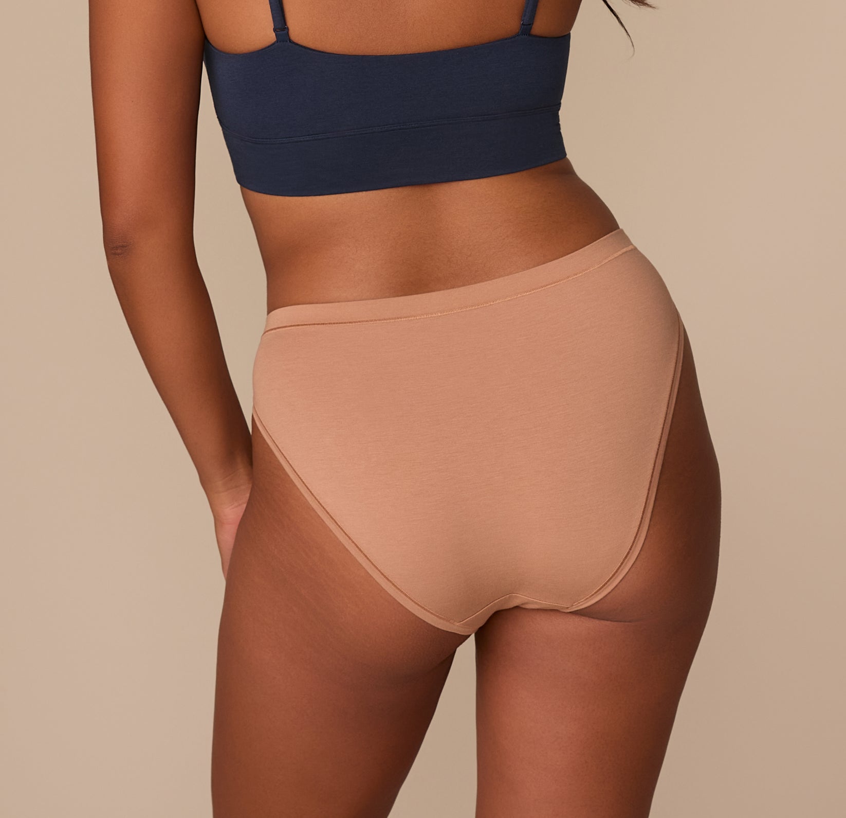 Back view of Victoria in the Cloud Cotton French Cut Brief in Dune. The image shows moderate back coverage and a smooth finish for everyday wear.