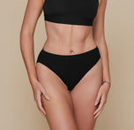 Front view of model wearing Cloud Cotton French Cut Brief in Black. The high leg and mid-rise waistband are emphasized.