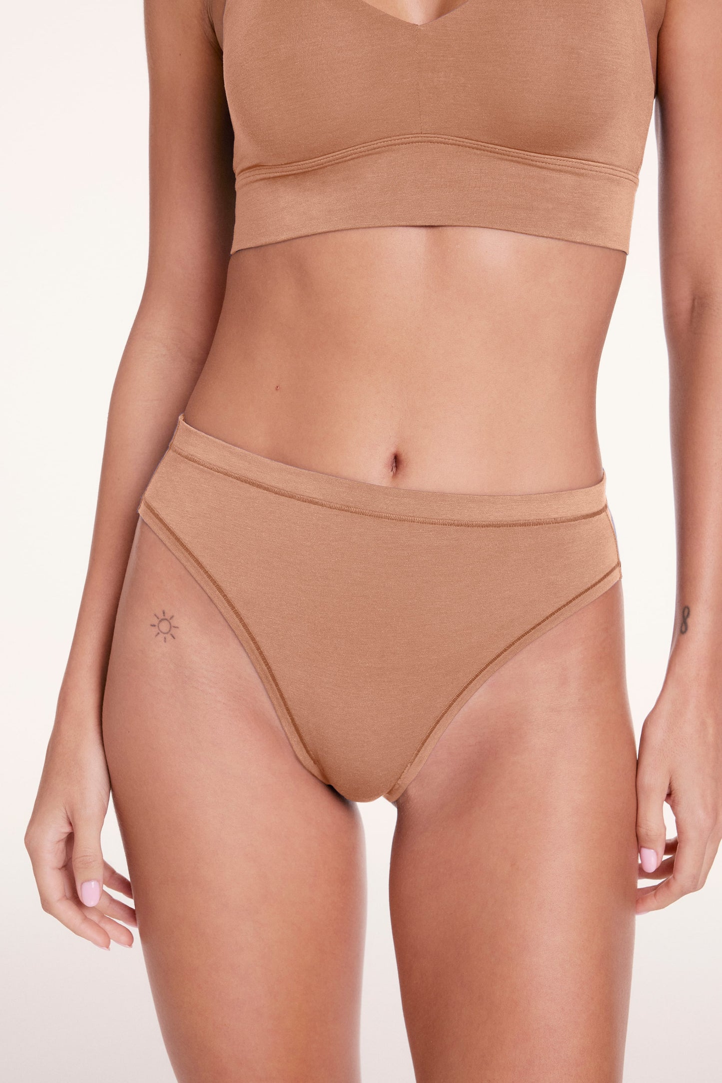 Close-up of the Cloud Cotton French Cut underwear in Dune, highlighting the high-cut leg opening, soft waistband, and smooth cotton modal fabric.