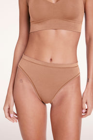 Close-up of the Cloud Cotton French Cut underwear in Dune, highlighting the high-cut leg opening, soft waistband, and smooth cotton modal fabric.