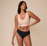 Full-body shot of Victoria in the Cloud Cotton Highwaist Thong and Bliss Bralette in Beige. The image showcases the full set, emphasizing soft stretch cotton and a comfortable fit.