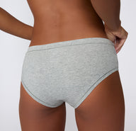 Back view on a light studio backdrop of the Cloud Cotton Hiphugger in Light Heather Grey, focusing on full back coverage and smooth leg openings.