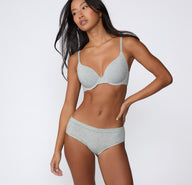 Full-body front view on a light studio backdrop of the Cloud Cotton Hiphugger in Light Heather Grey, paired with a Cloud Cotton bra for a coordinated set.