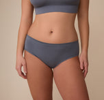 Front view of Sonnie wearing the Cloud Cotton Hiphugger in Slate. The image showcases the hip-hugging cut and soft ribbed texture, sitting comfortably just below the waist. sizing: Sonnie wears size Large