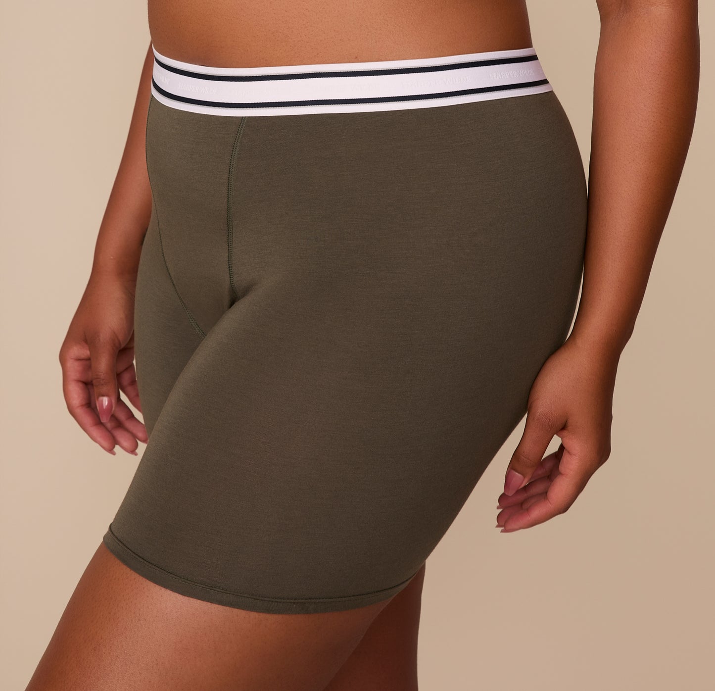 Side view close-up of Zarria in the Cloud Cotton Retro Boxer Brief in Olive, showing the soft cotton-modal fabric and supportive waistband.