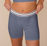 Close-up of Freya wearing the Cloud Cotton Boxer Brief in Slate, highlighting the retro-inspired striped waistband and smooth, form-fitting cotton modal blend.