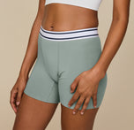 Close-up of the Cloud Cotton Logo Boxer Brief in Seaglass, worn by model Zoe. The image highlights the soft, stretchy waistband and fabric. 