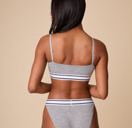 Back view of Ally in the Cloud Cotton Retro Bandeau Bralette in Heather Charcoal, showcasing the adjustable straps and snug underband.
