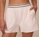 Close-up of the Cloud Cotton Sleep Short in Quartz, showing the branded waistband, mock fly with buttons, and soft side pocket.