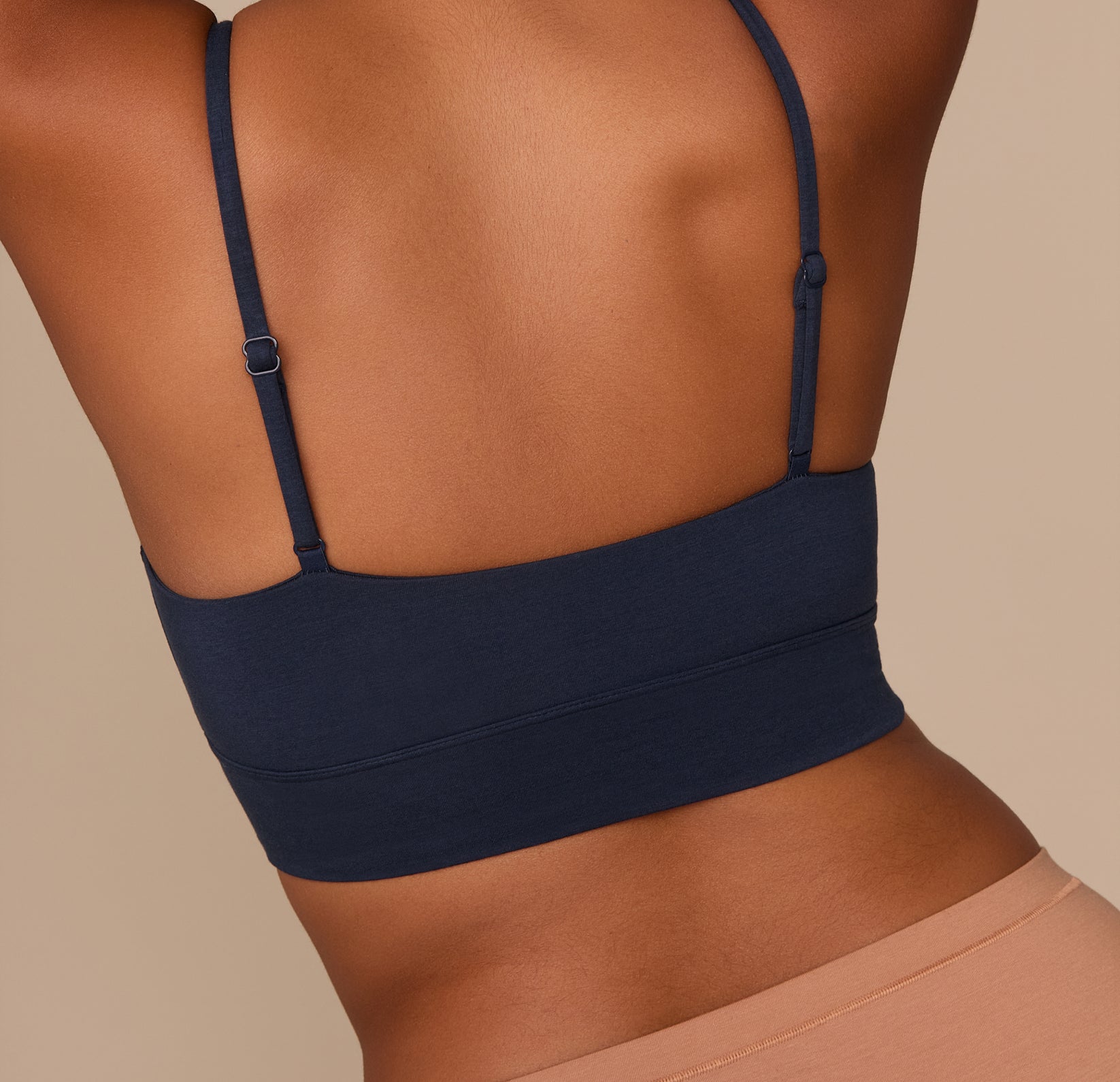 Close-up of the back of the Cloud Cotton Thin Strap Bralette in Midnight, showing the thin adjustable straps and smooth back panel for all-day ease.