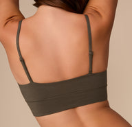 Back close-up of Alexis in the Cloud Cotton Thin Strap Bralette in Olive, focusing on the thin adjustable straps and smooth finish.