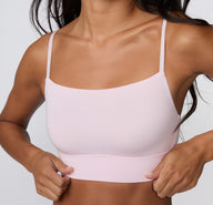 On a clean studio backdrop, a close-up shows a model wearing the Cloud Cotton Thin Strap Bralette in Primrose, highlighting the soft square neckline, thin adjustable straps, and smooth longline cotton modal band.