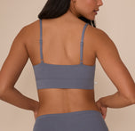 Back view of Nemesis in the Cloud Cotton Thin Strap Bralette in Slate, showcasing the wide back band and thin adjustable straps for customizable comfort.