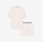 Flat lay of the Cloud Cotton Sleep Set in Quartz, featuring a short-sleeve tee with chest pocket and matching boxer-style sleep shorts. The shorts have a button fly and tonal waistband with a thin black stripe detail. Displayed against a white background for a clean, minimal presentation.