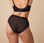 Rear view of the ComfortMesh™ Highwaist Brief in Black on a second model. The high-rise cut and stretchy fabric provide a supportive, form-fitting style with flattering back coverage.