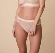 Close up shot of the ComfortMesh Highwaist Brief in Pearl. The sheer fabric is emphasized. sizing: Gracie wears a size Small 