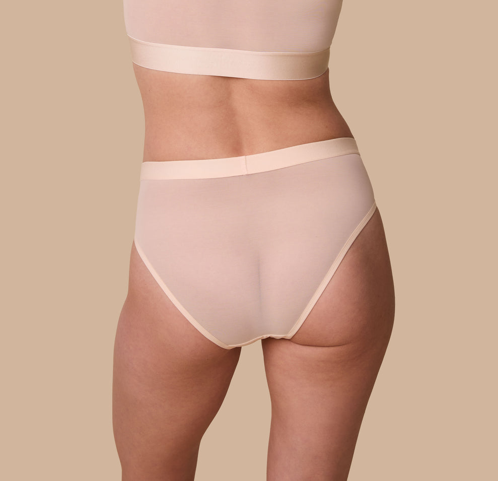 Rear view of the ComfortMesh™ Highwaist Brief in Pearl. The soft, breathable fabric hugs the curves gently, while the high-rise waistband provides a supportive fit.