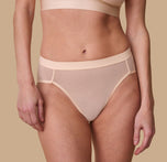 Front close-up view of the ComfortMesh™ Highwaist Brief in Pearl on a second model. The sleek waistband and flattering seams provide a polished and comfortable look. 