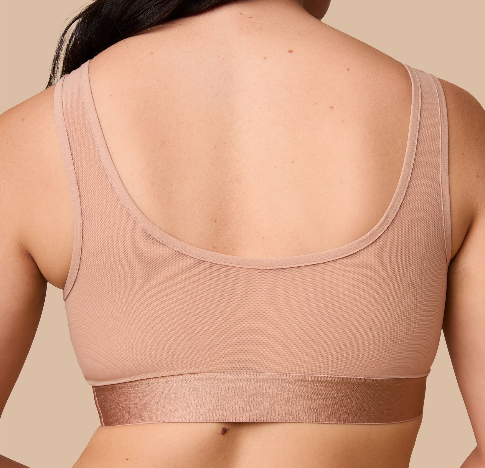 Close-up of the back of the ComfortMesh™ Scoop Bralette in Taupe. The lightweight material and wide band showcase a smooth and secure fit.