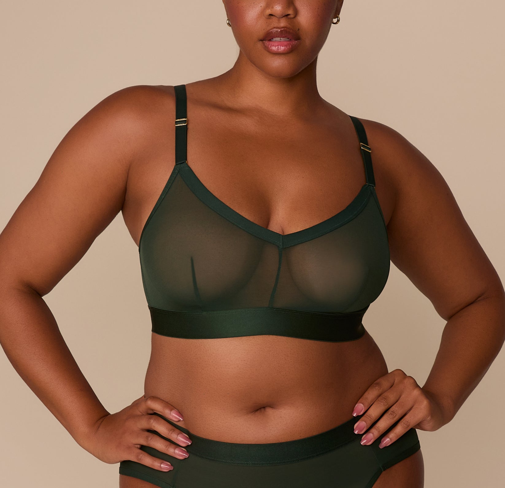 Front view of Zarria wearing the ComfortMesh™ Triangle Bralette in Sequoia. The sheer mesh fabric and plunging V neckline highlight the light, breathable construction. sizing: Zarria wears size XL