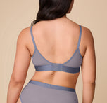 Back view of Emersyn in the ComfortMesh™ Triangle Bralette in Steel. The image highlights the adjustable straps and hook-and-eye closure with a supportive mesh back panel.