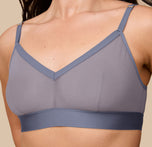 Close-up of Emersyn wearing the ComfortMesh™ Triangle Bralette in Steel. The image draws attention to the triangle cup design and soft, breathable mesh fabric.