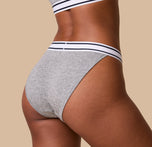 Close-up of the Cloud Cotton Retro French Cut Bikini in Heather Charcoal on India. The stretch and softness are emphasized. sizing: India wears size Large