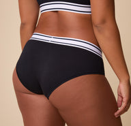 Detailed close-up of the waistband of the Cloud Cotton Retro Hiphugger in Black. The image captures the soft cotton texture and the bold, sporty waistband. 